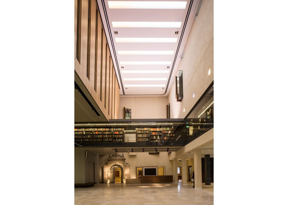 The Blackwell Hall looking east showing the first floor open access shelving and the hall’s palette of Jura limestone, rough cast plaster and oak.