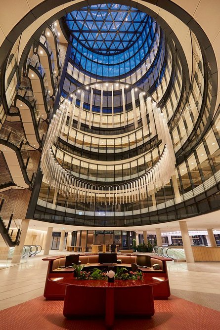 To aid orientation, open stairs create visual connections between lift lobbies and the tapering atrium.