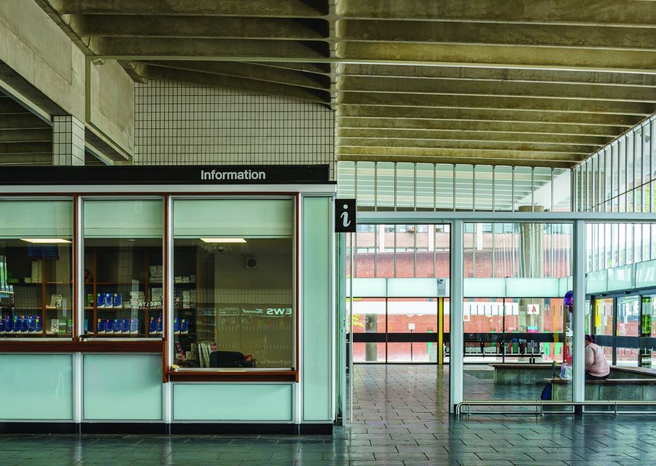 Insertions such as the reception pod use the lighter language of steel and glass but also repurpose the original iroko barrier boards.