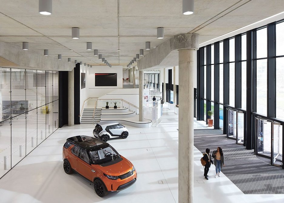 The entrance hall with glass wall on the left looking through to the engineering hall.