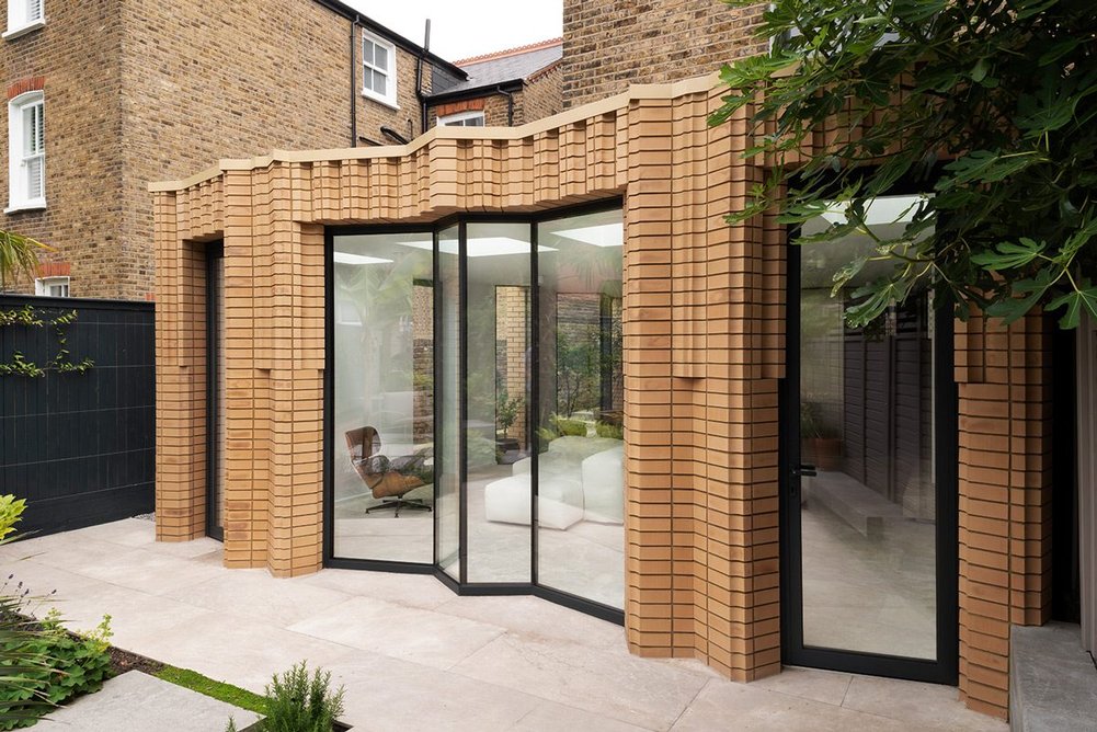 Folded glazing enhances the rhythm of the façade.