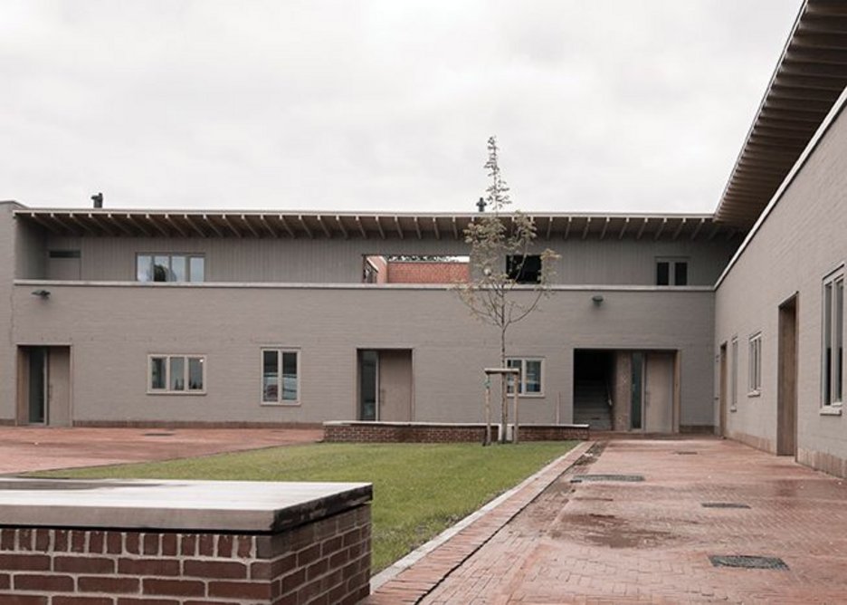 The flats cupping the shared courtyard.