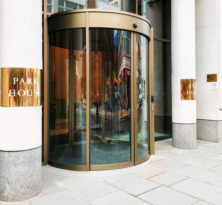 Park House entrance with Boon Edam Circleslide curved sliding door in bronze anodised finish.