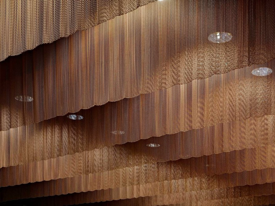 The bronze curtains helped control the acoustics at the British Film Institute’s Reuben Library, designed by Coffey Architects.
