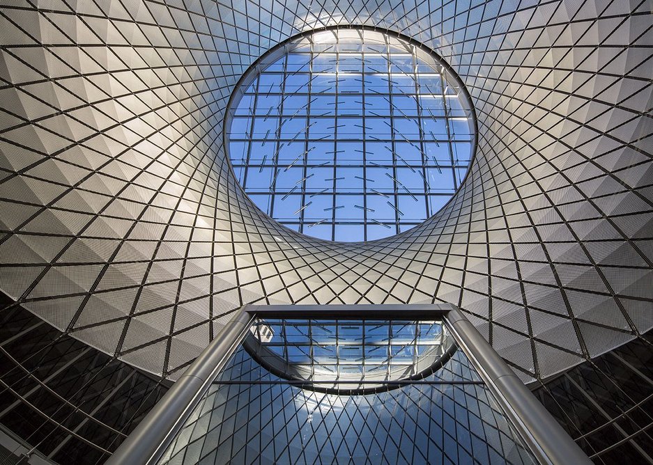 The cable-net structure of the oculus clad in aluminium panels.