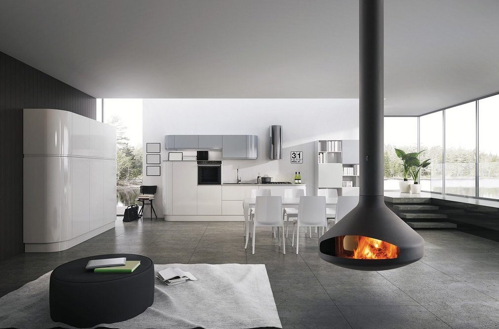The Glazed Ergofocus: The size of the graceful flue is adjusted according to the space it will occupy.