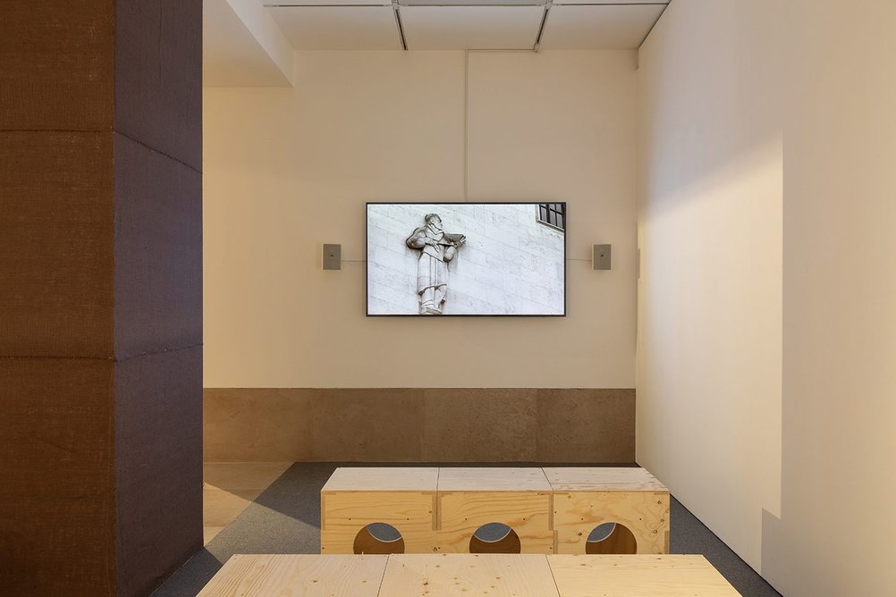 Installation shot of Raise the Roof showing Esi Eshun’s 15 minute video, a response to the Jarvis Mural at the RIBA’s 66 Portland Place headquarters in London.
