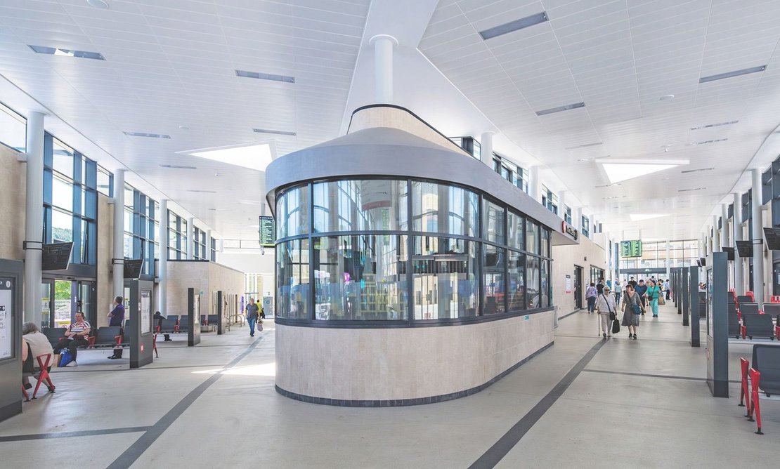 Triangular roof windows illuminate concourses meeting at the Travel Centre.