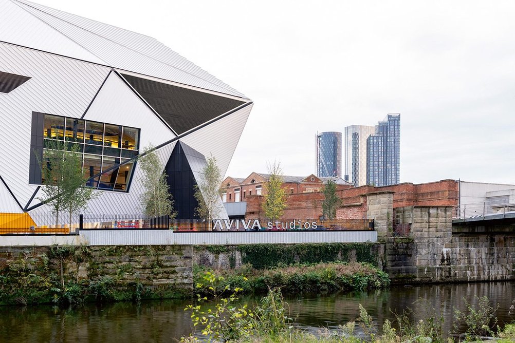 Two performance space are raised in the air, high above the River Irwell.