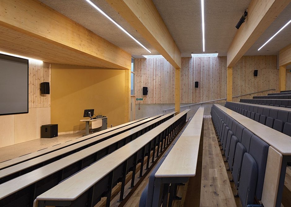 Huge glulams span the wide lecture theatre.
