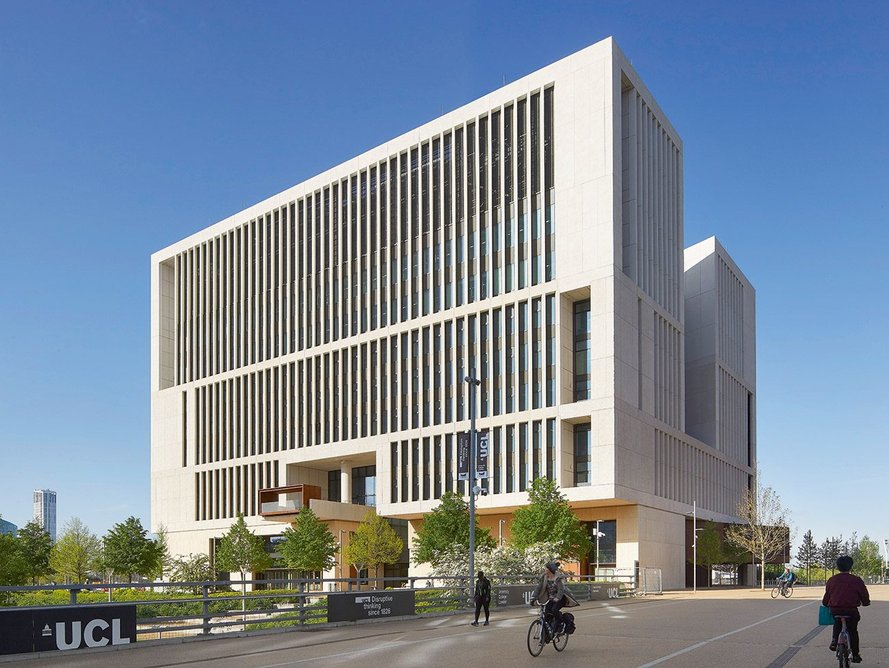 Tall, vertical precast concrete slats accentuate the massive scale of the new campus building.