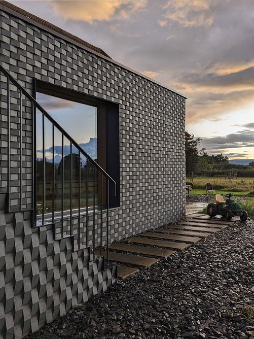 Sawtooth bricks reflect the changing light.