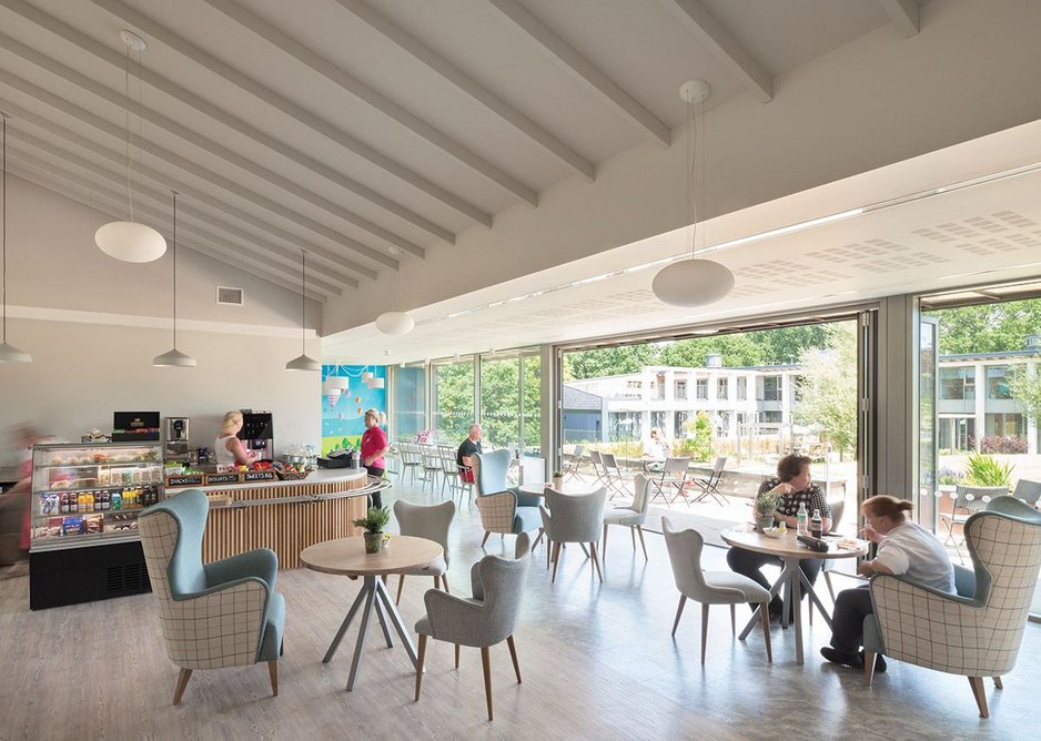 Zeppo suspended lighting domes and Ginestra pendant lamps from Astro animate the loftier interior of the café. Flush strips are specified as the space opens to the garden.