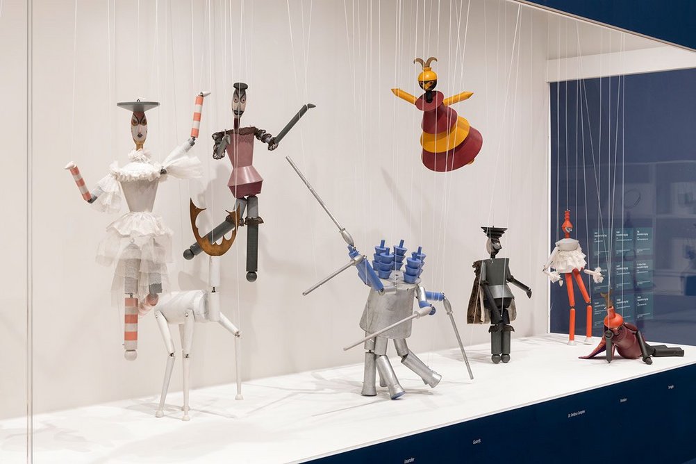 Installation image of the exhibition Sophie Taeuber-Arp showing marionettes designed by her for the performance of the play King Stag in 1918.