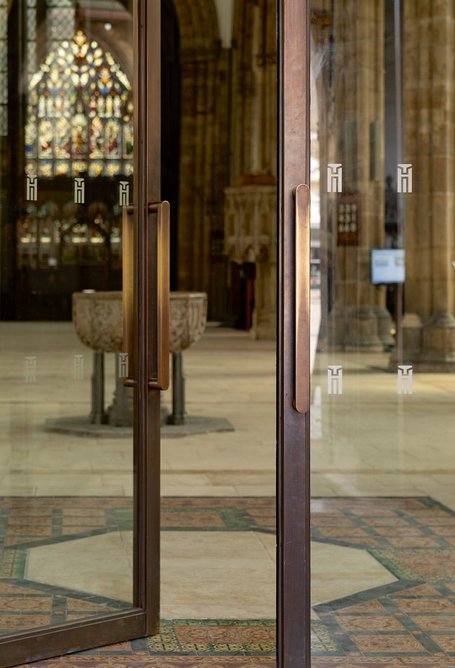 Elegant doors give the narthex inside the church ceremonial weight.