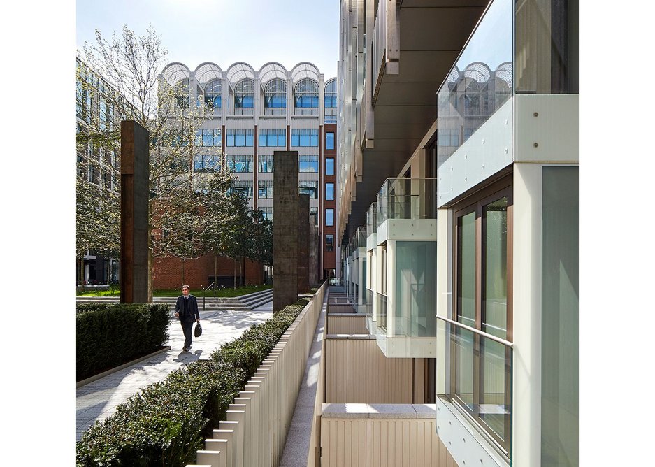 The public are held at a distance from lower ground floor flats by fencing, hedges and Corten verticals.