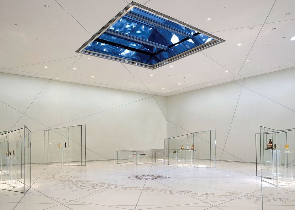 The Grand Vestibule; white, minimalist, with small groupings of exhibits in delicate, bespoke vitrines, sets the tone of the whole gallery experience.