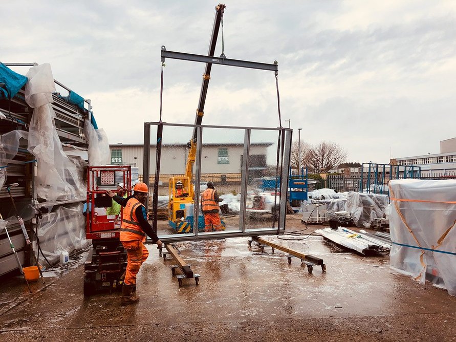 The reused curtain walling system for Arup's 1 Triton Square arriving at the temporary ‘remanufactory’.