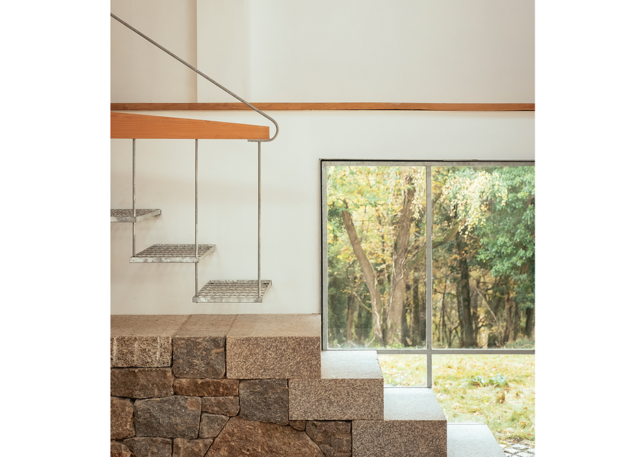 Stone and steel stairs ascend to the Winter Studio.