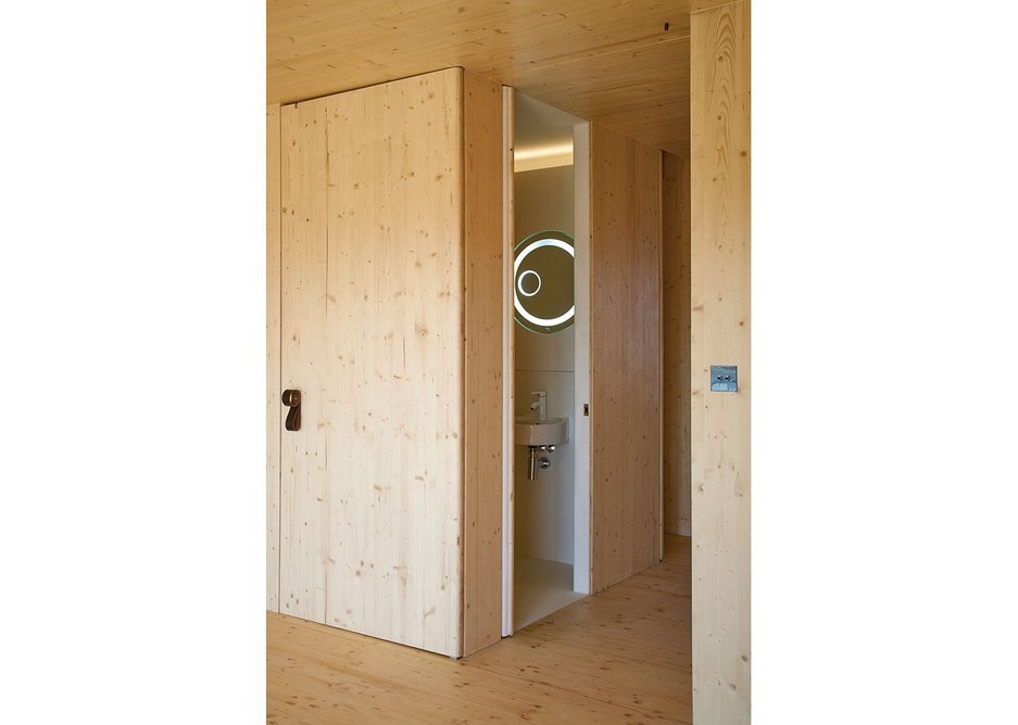 At Amin Taha and Groupwork’s Barratts Grove housing, the rich, warm, timber cladding outside the bathroom is counter pointed by 2001-like stark whiteness within – tile free to cope with structural movement.