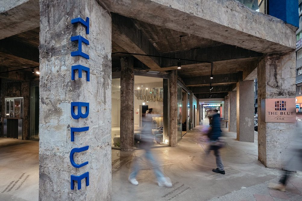 The newly accessible ground floor, glazed between columns with a surrounding colonnade, at The Blue, Taipei.