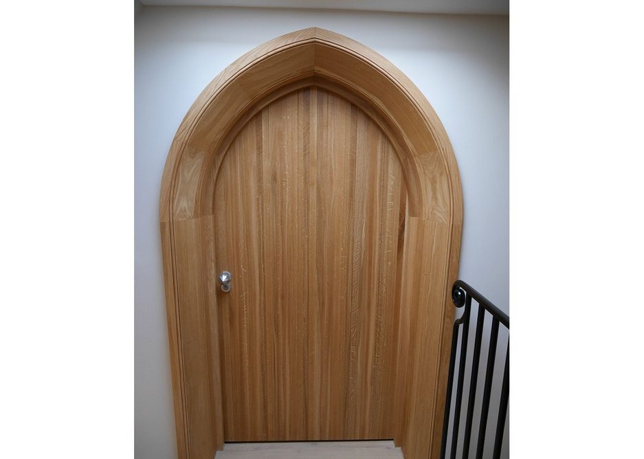 New door, old style. Gothic oak joinery forms entrance to the new tower rooms.