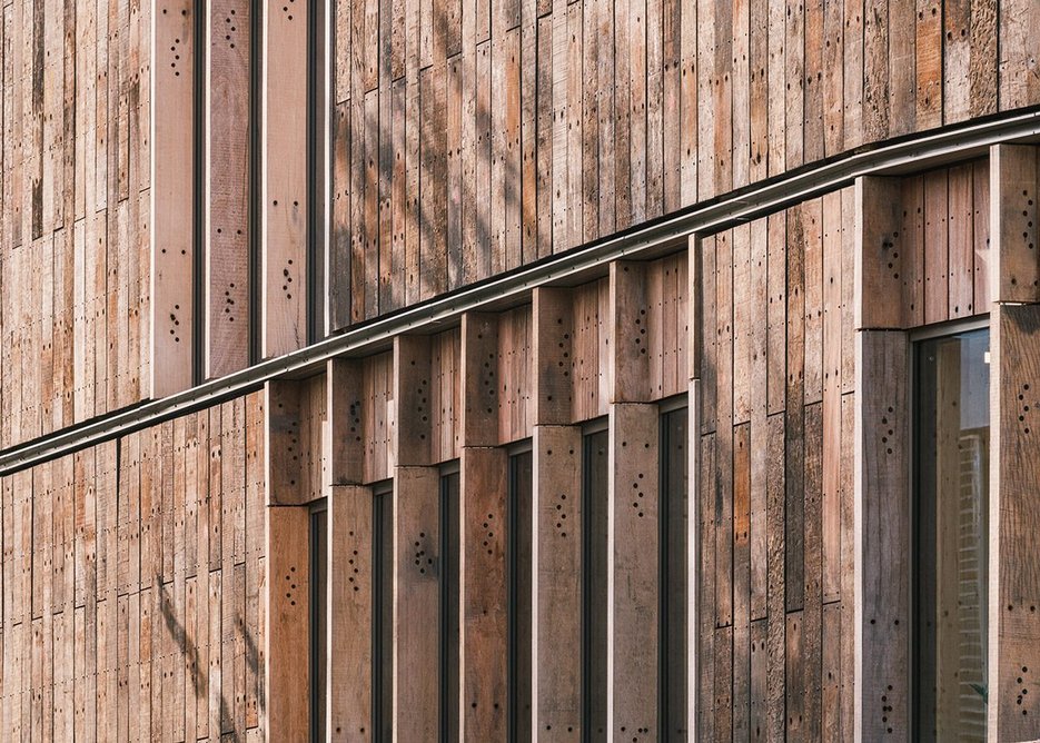Reclaimed timber sleepers on the facade of Roundhouse Works in Camden, designed by Reed Watts Architects with Paddy Dillon Architect.