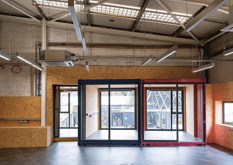 Looking from the breakout space to the container meeting rooms.