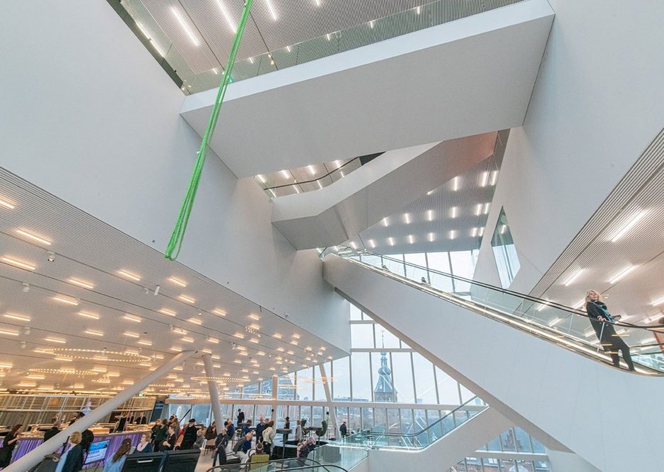 Looking up and down the atrium to the escalators and bridges that encourage a slow route of exploration through the many different attractions of the building.