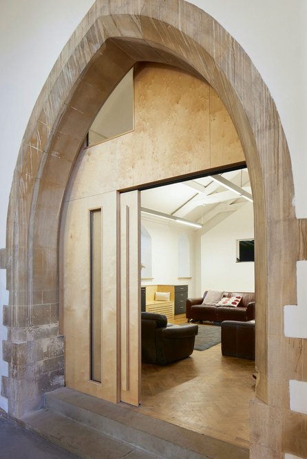 Pleasingly simple partition and sliding door to the meeting and Sunday School space.