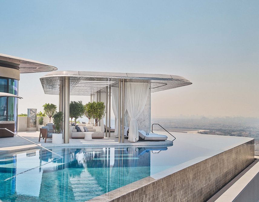 Rooftop infinity pools overlook the city.