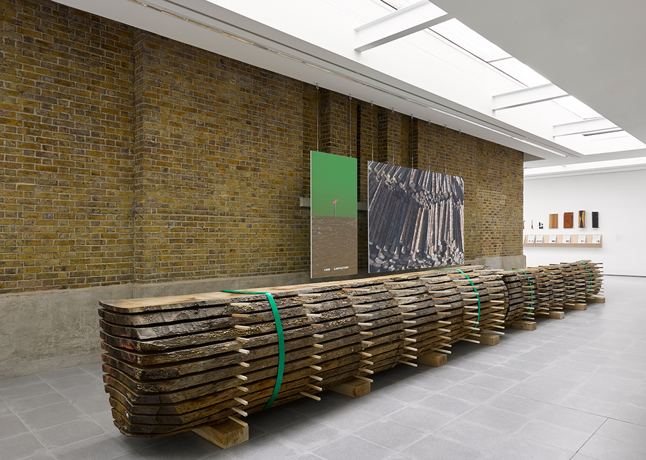 Installation view of Formafantasma: Cambio at the Serpentine Galleries, London. Photo credit: George Darrell. In the foreground is a locally sourced oak in the early stages of being processed into timber.