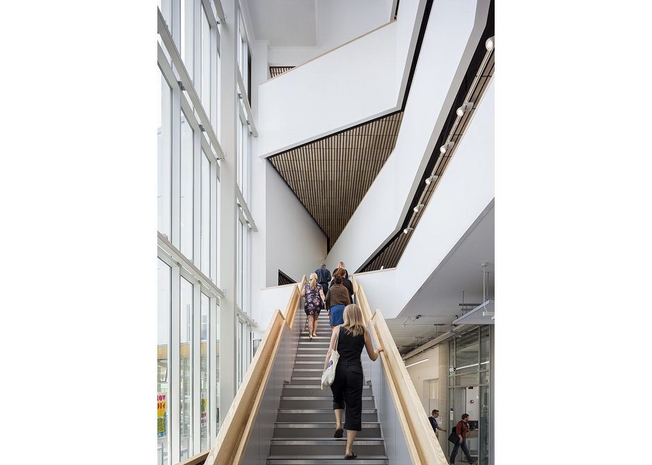 The atrium along the east side of the building visually connects faculty entrance, courtyard and studios