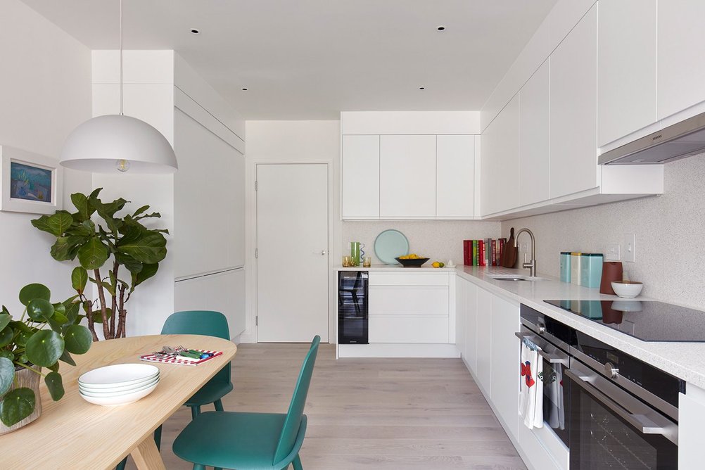 A townhouse kitchen with terrazzo worktops, positioned facing the private courtyard and communal gardens.