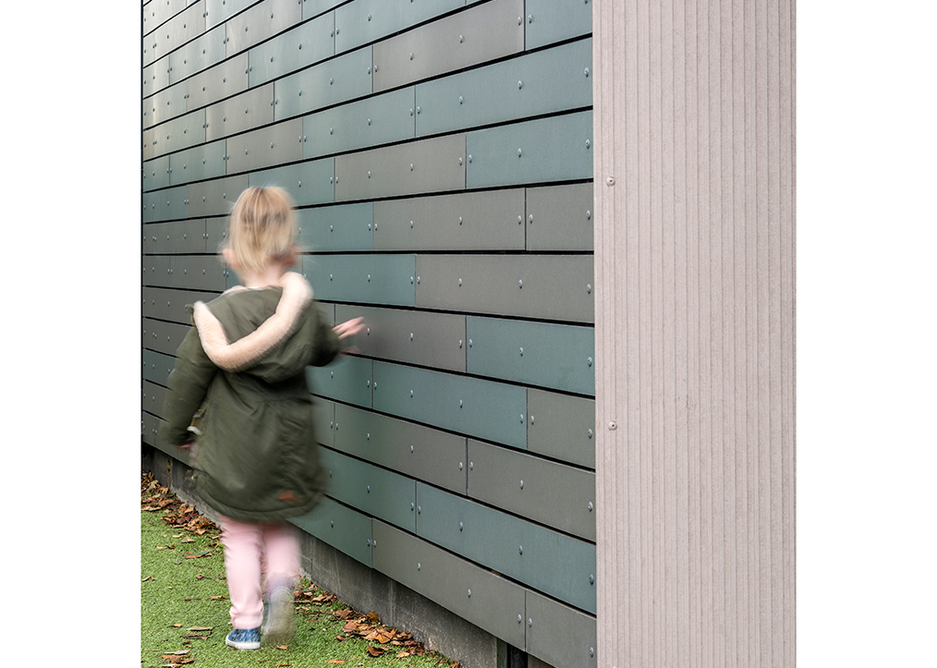 Texture at just the right height: A young girl runs her fingers across panels of Natura.