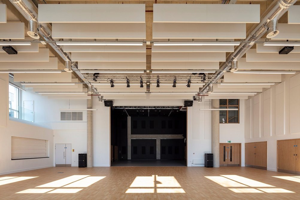 The school hall opens onto a drama study that acts as a proscenium stage for performances.
