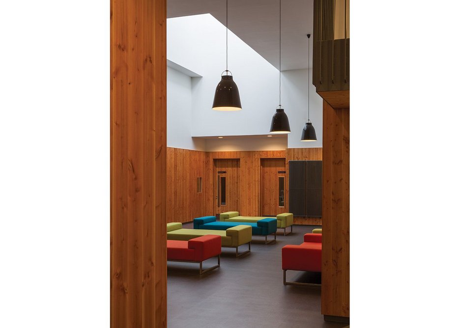 Douglas fir, floor tiles and lighting link the three social spaces visually even though they are spread across the building.