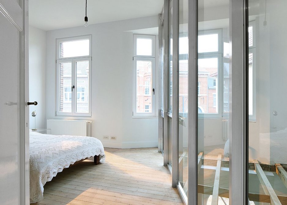 On the south face, the main bedroom now has an angled glass wall that carries through into the adjacent study space.