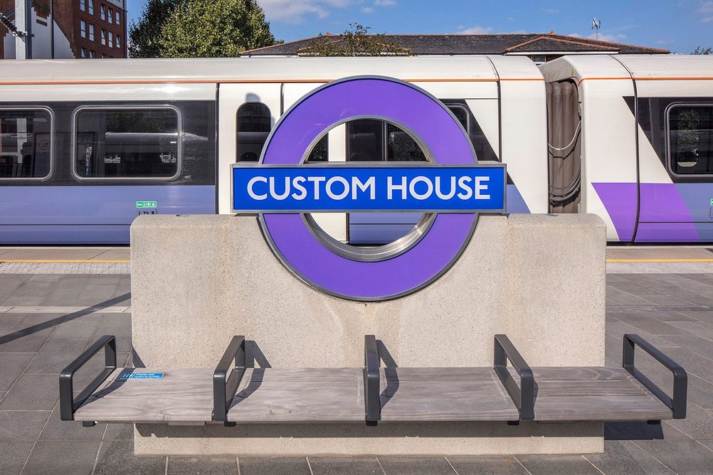 Seating and signage at Custom House Station by Allies and Morrison.