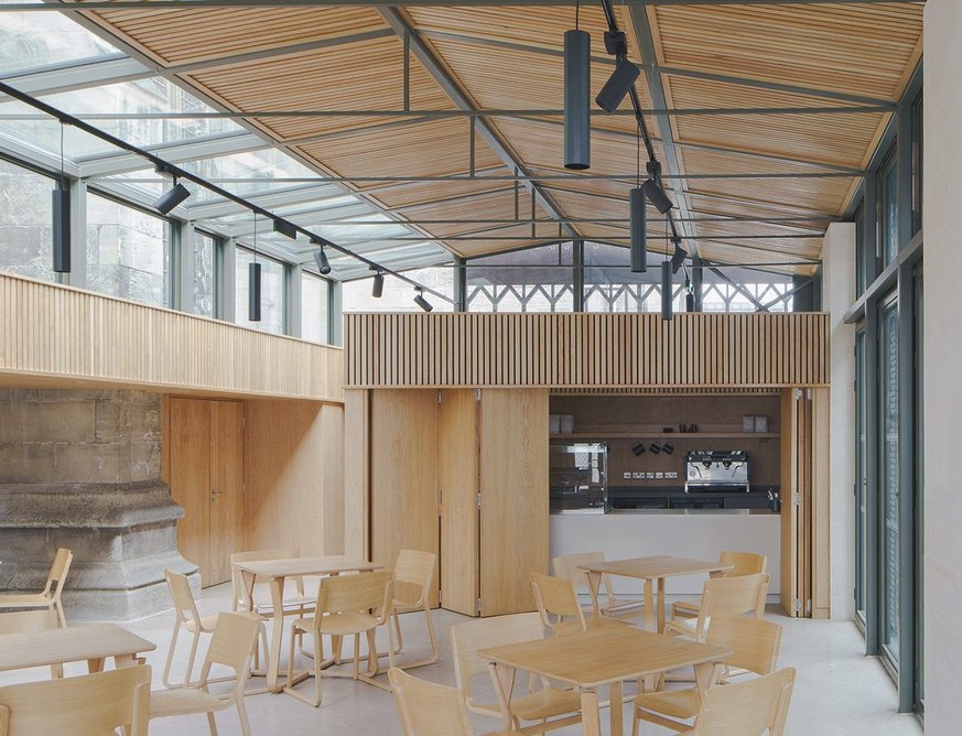 Concertina doors open up the servery, which can be quickly hidden away for other activities in the space.