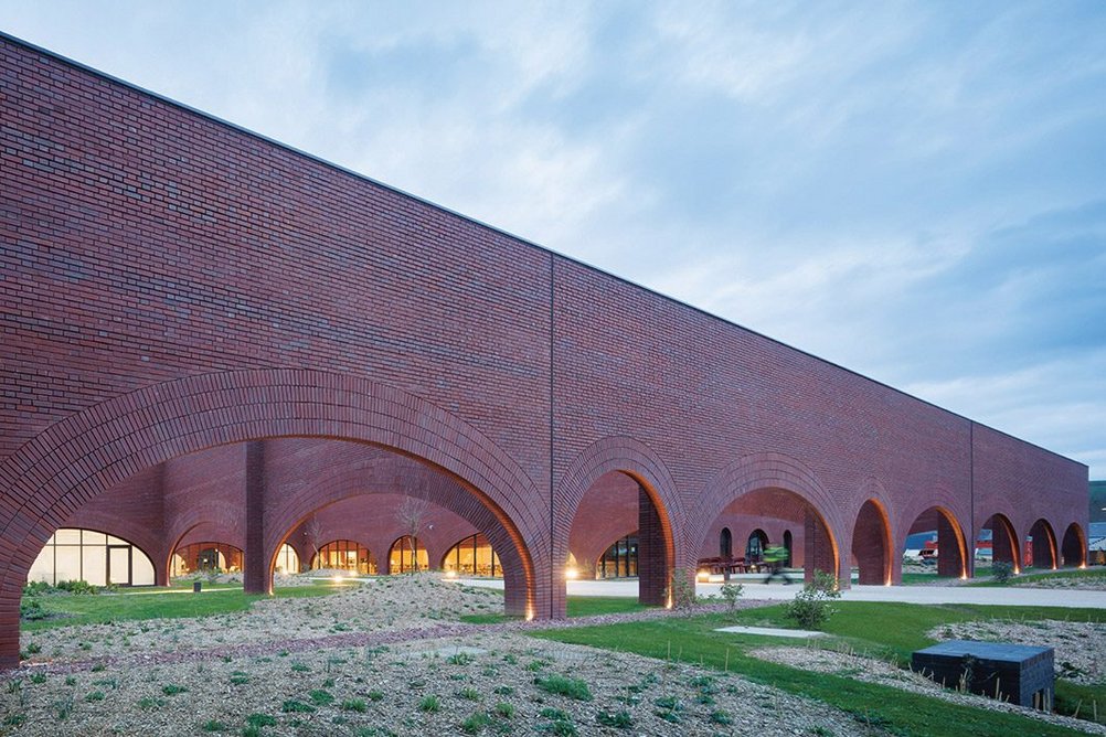 The new Hermès leatherwork facility in Louviers, Normandy. The arches echo the movement of horses, the courtyards allow room for expansion.