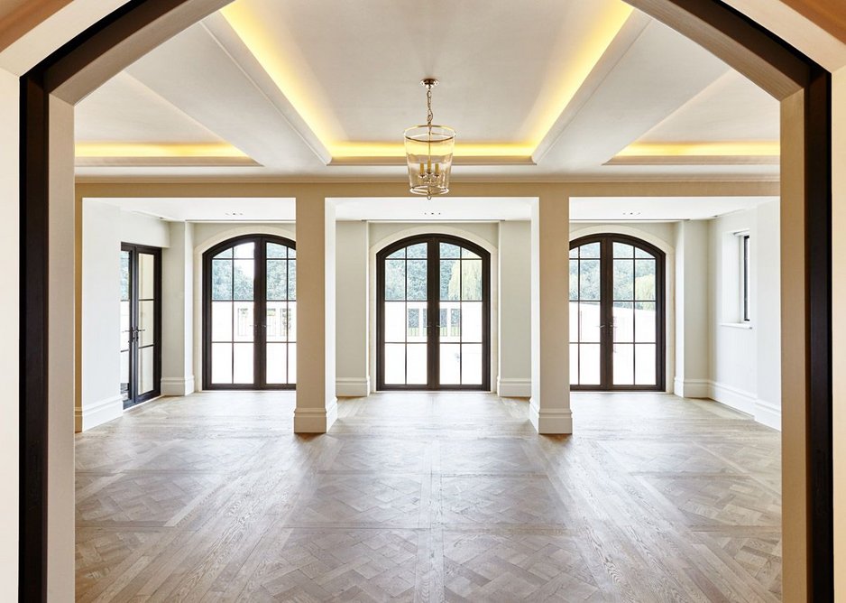 Architectural Bronze Casements' shaped bronze doors in a Surrey new-build. Gebler Tooth architects.