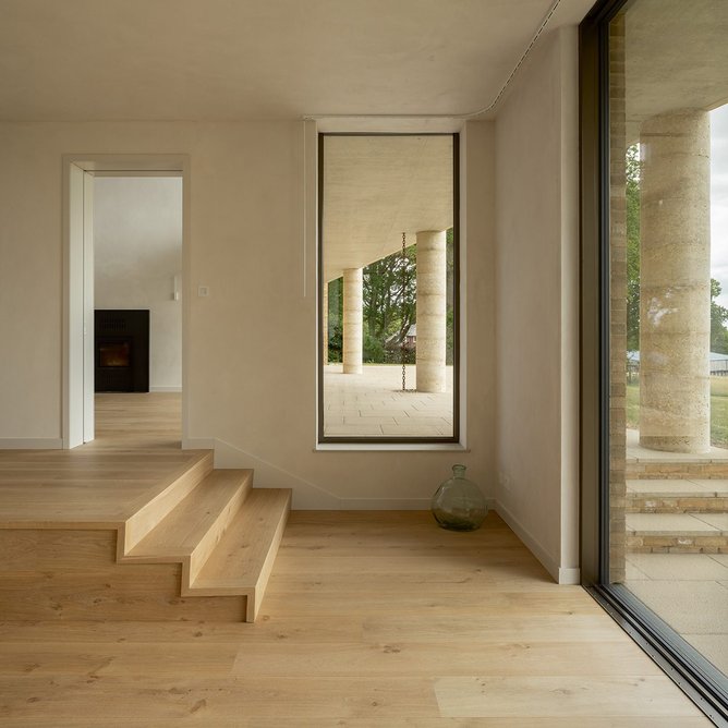 The colonnade through the window from the formal sitting room, which steps down the site.