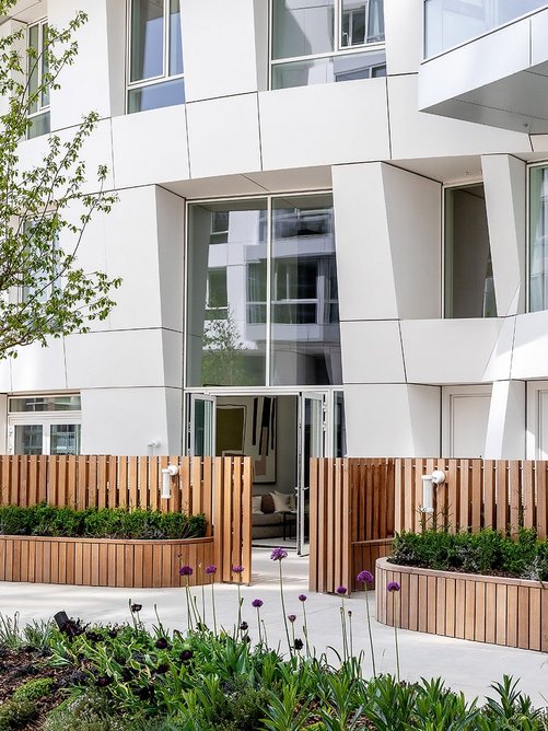 Townhouses have their own little picket-fenced front yards.