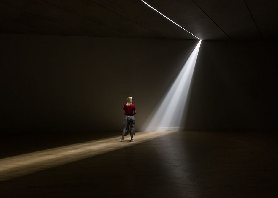 A shaft of light occasional penetrates the underpass from above.