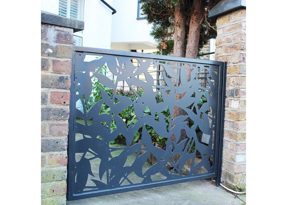 The ornate laser cut screens create an open pattern of light and shade without leaving the garden too exposed