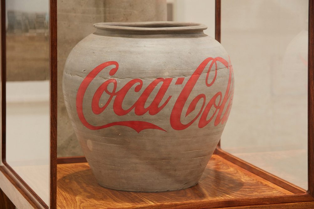 Installation view of Ai Weiwei: Making Sense at the Design Museum showing Han Dynasty Urn with Coca-Cola Logo, 2014.
