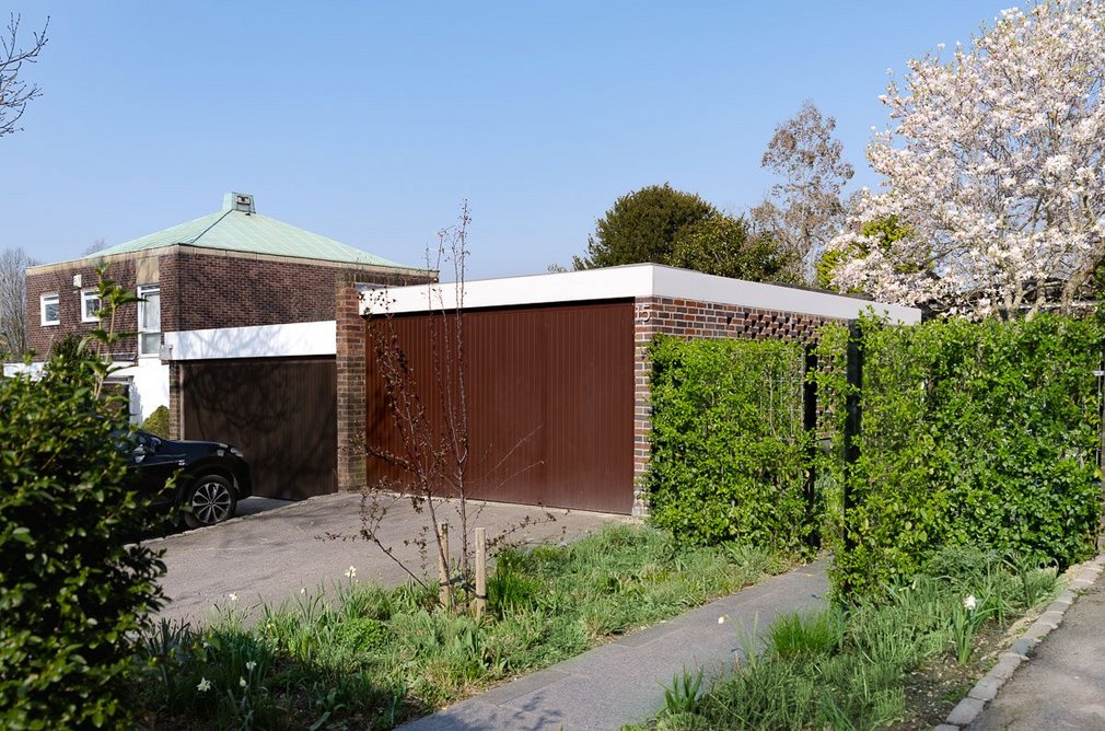 The new extension is designed to blend in with neighbouring garages.