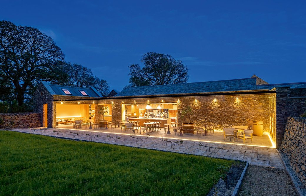 A huge expanse of glass sits between garden and café.