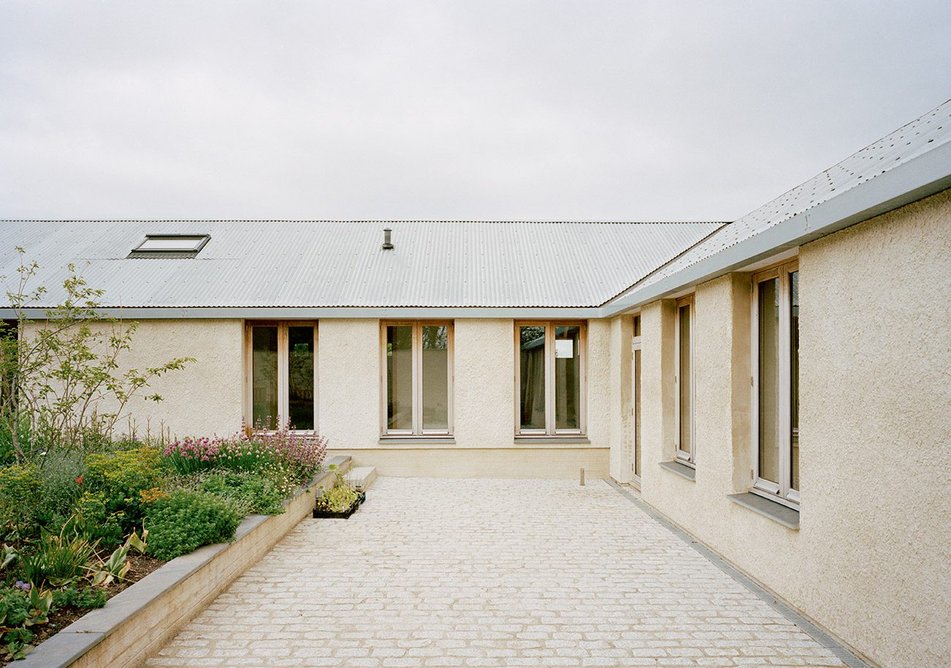 The courtyard garden is a place for play, growing vegetables and domestic activities.